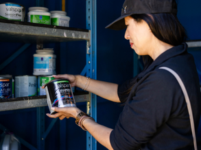 Household Hazardous Waste Collection Facility reuse shop, person looking at paint